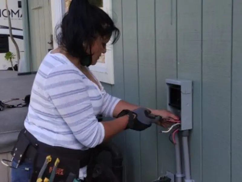 Licensed electrician wiring an exterior subpanel in The Hammocks